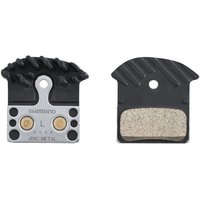 Shimano J04C metal brake pad with cooling fin, black and silver, includes spring, textured surface.