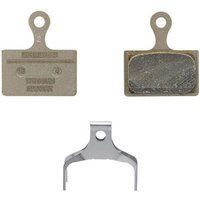 Shimano K05TI-RX disc pads with resin braking, metallic finish, and included spring clip.