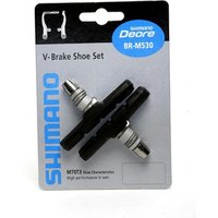Shimano M600 V-brake blocks, black with silver fittings, mounted on a branded card backing.