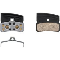 Shimano P04C-MF XTR sintered brake disc pads with metal backing and copper-colored friction surface.
