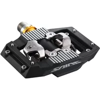 Black Shimano PD-M821 Saint SPD pedal with silver clip mechanism and striped platform design.