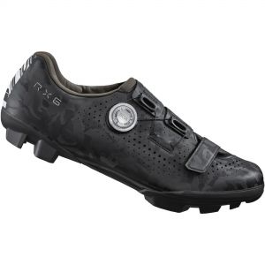 Black Shimano RX6 gravel shoes feature a camo pattern, breathable perforated material, dual BOA dial closures, and rugged soles designed for off-road traction.