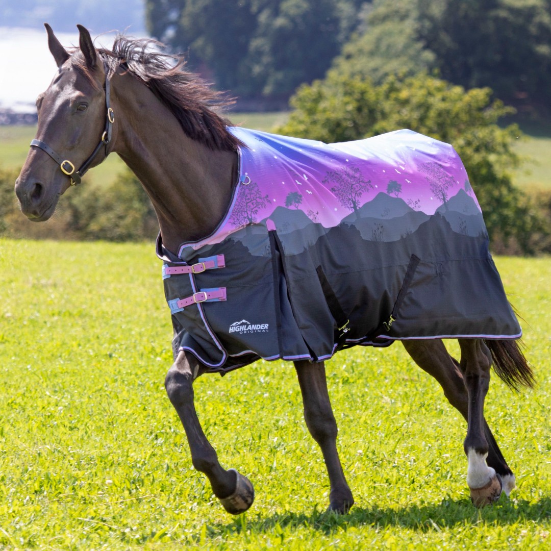 Shires Highlander Original Lite Turnout Rug in Spring Morning design features a purple and black mountain landscape, with two pink front buckles, designed for a 5'3" horse.