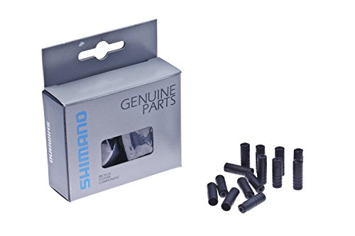 Black Shimano SIS SP40 outer gear casing caps, made of durable plastic, displayed next to a sealed box containing 100 caps, with a silver and blue packaging design.