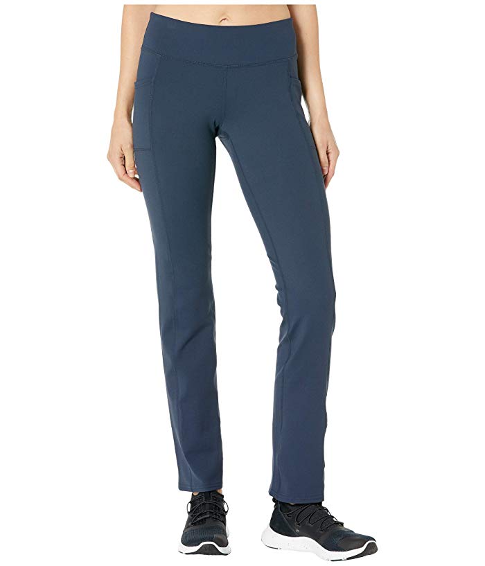 Navy blue women's golf pants by Skechers Performance, featuring a stretchy, moisture-wicking material, slim fit, and side pockets for convenience.