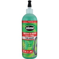 Green Slime Tube Sealant bottle, 473ml, with black nozzle and red label detailing flat tire prevention and repair.