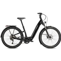 Black Specialized Como 3.0 electric bike with step-through frame, rear rack, and front suspension fork.