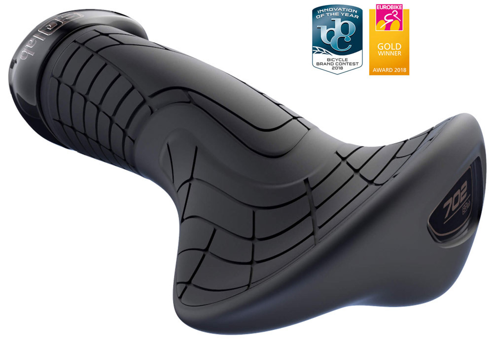 Black ergonomic bicycle grips with a textured surface for improved grip, featuring a unique shape and the "702" logo, designed for comfort and control.