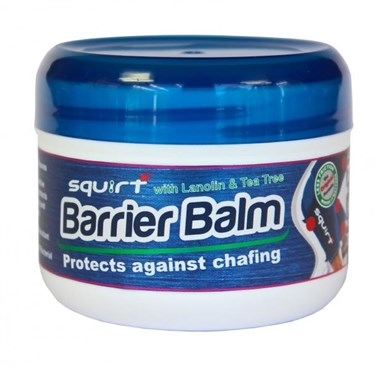 Round, white container with a blue lid labeled "Squirt Barrier Balm," featuring text highlighting protection against chafing and ingredients like lanolin and tea tree.