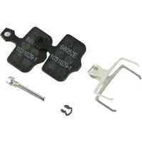 SRAM disc brake pads in black with steel backing, includes spring clip and small metal pin for secure attachment.