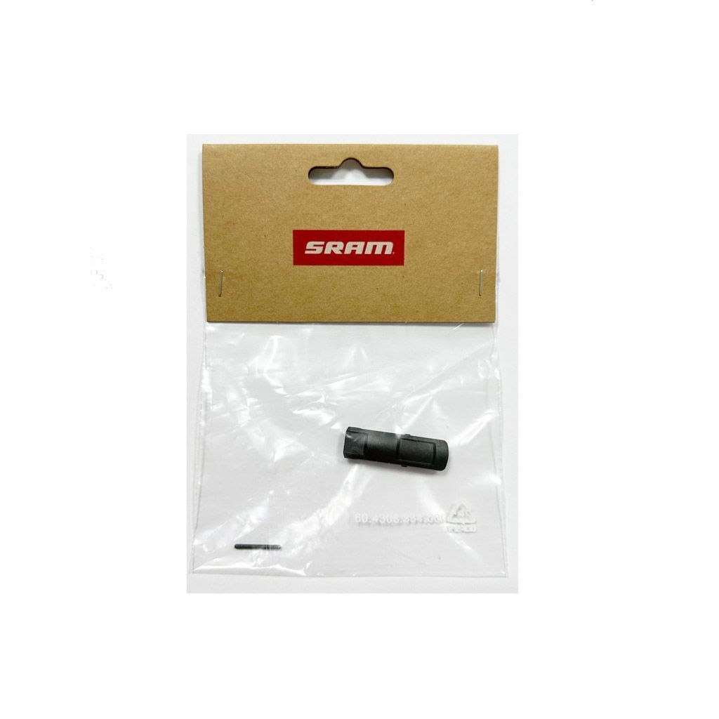 Gray plastic derailleur battery locking clip/lever for SRAM T-Type AXS, displayed in a clear plastic packaging with a brown cardboard backing and red SRAM logo.