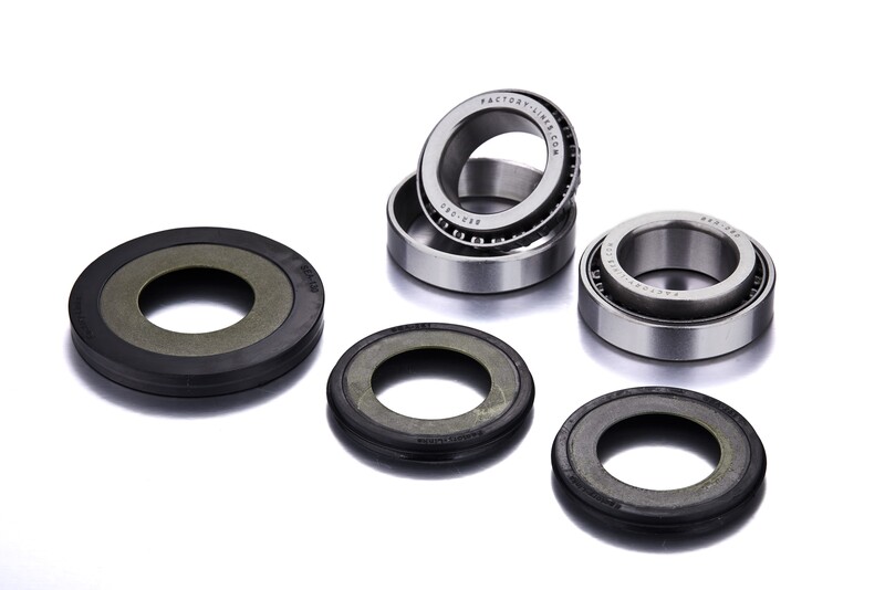 Steering stem bearing kit featuring metallic silver bearings and black rubber seals, designed for Suzuki RM-Z250/450, showcasing precision engineering and durability.