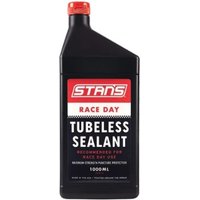 Black bottle of Stans Race Tyre Sealant with red cap and bold white text on label.
