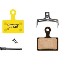 Yellow Swissstop RS disc brake pads with metal backing plate, screws, and mounting hardware.