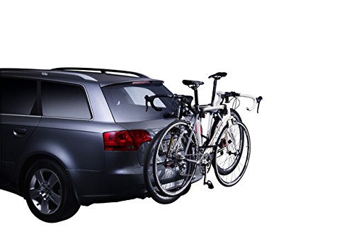 Thule 970 Xpress 2 Bike Cycle Carrier in black and silver, mounted on a gray car, securely holding two bicycles with a sleek, lightweight design.