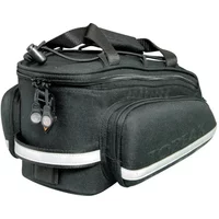 Black Topeak RX Trunk Bag EX with top handle, side pockets, reflective strip, and zippered compartments.