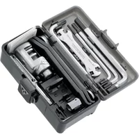 Compact black Topeak Survival Gear Box with assorted bike tools, including wrenches, Allen keys, and a chain tool.