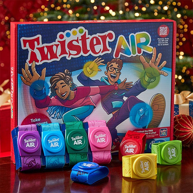 Colorful Twister Air game box featuring two children playing, with six wristbands in pink, blue, green, yellow, and purple, each labeled "Twister Air."