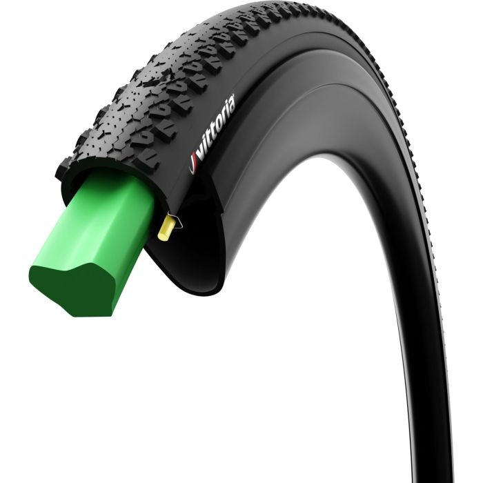 Vittoria AirLiner tyre insert in black rubber with a textured surface and a bright green foam core, designed for 700C light gravel cycling.