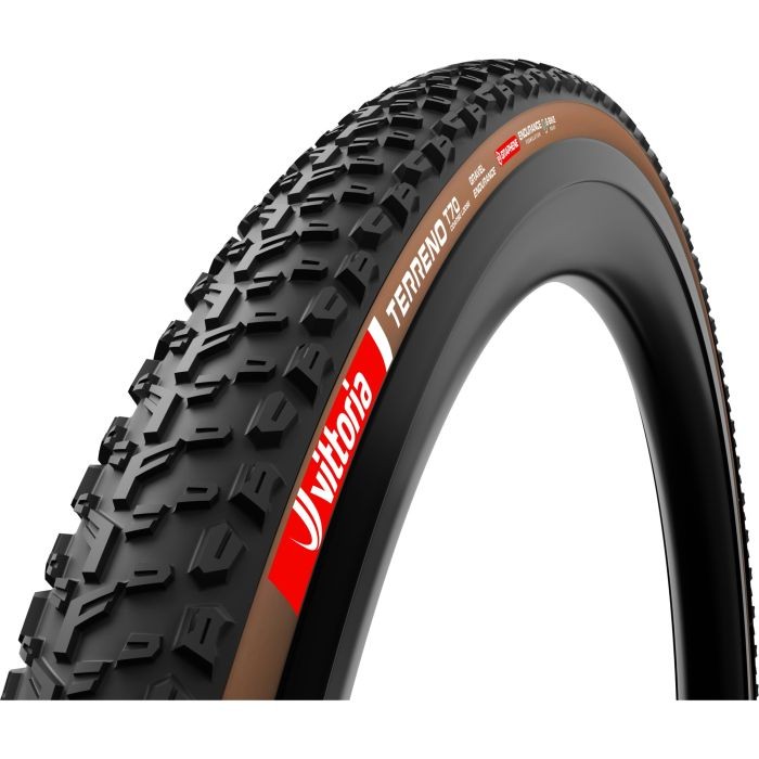 Vittoria Terreno T70 Coarse Loose G2.0 TLR gravel tyre in black with tan sidewalls, featuring a rugged tread pattern for enhanced traction, marked with the Vittoria logo and specifications.