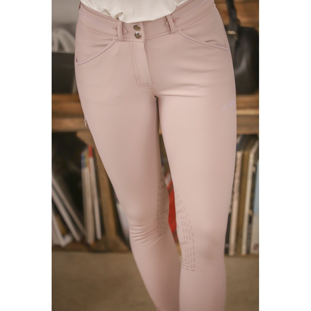 Light pink women's mid grip riding trousers by Pénélope, featuring a sleek fit, subtle stitching details, and textured grip panels on the inner thighs for enhanced performance.