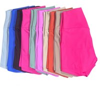 Colorful array of women's high-waist yoga shorts, featuring pink, blue, black, and beige, designed for fitness and quick drying.