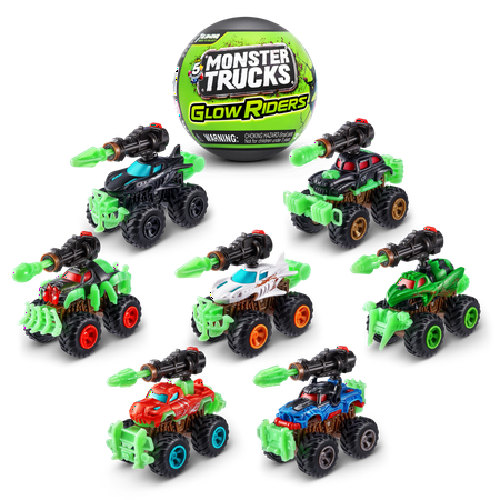 Eight colorful monster trucks in various designs, featuring green and black bodies, glowing accents, and unique details, arranged around a black capsule labeled "Monster Trucks Glow Riders."