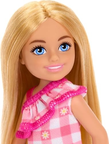 Barbie Chelsea doll features long blonde hair, blue eyes, and a removable pink checked dress with ruffled detailing.