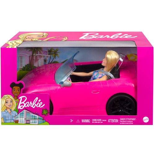 Blonde Barbie doll in a pink convertible, wearing a blue outfit, packaged in a colorful box featuring tropical designs and the Barbie logo.