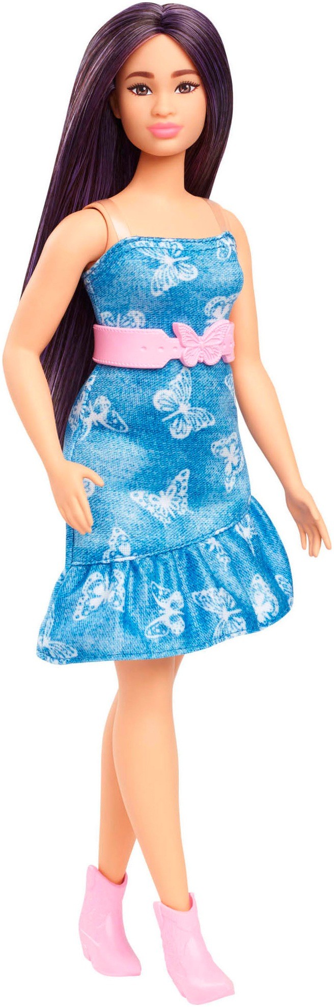 Barbie Fashionistas doll wears a denim butterfly print dress with a pink belt and bow, featuring long dark hair and pink ankle boots.