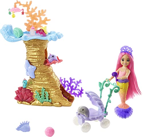 Barbie Mermaid Power Chelsea Playset features a colorful coral tower, a mermaid doll with pink hair, a stroller with a purple sea creature, and various underwater accessories.