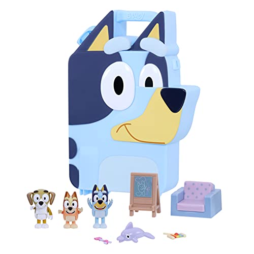 Bright blue playset shaped like Bluey's head, featuring a handle, four character figures, a small sofa, a chalkboard, and colorful accessories for imaginative play.