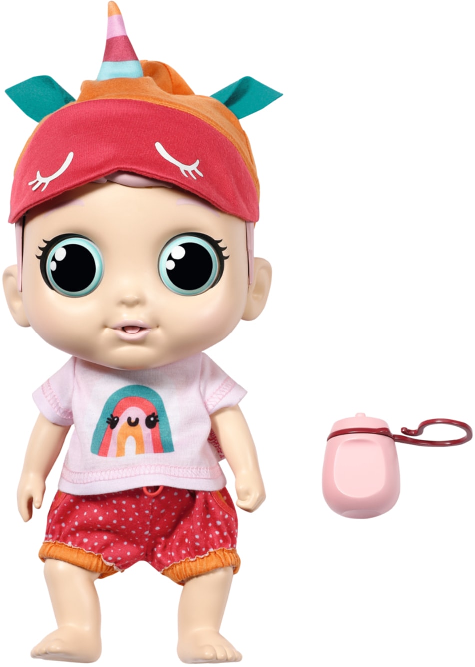 A cute baby doll with large blue eyes, wearing a colorful unicorn hat, a pink shirt with a rainbow design, and polka dot shorts, accompanied by a small pink bottle.