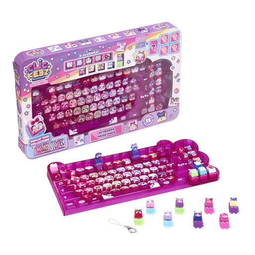 Colorful plastic keyboard-shaped pack containing various small mystery figures in vibrant colors, featuring cute animal designs and a keychain attachment.