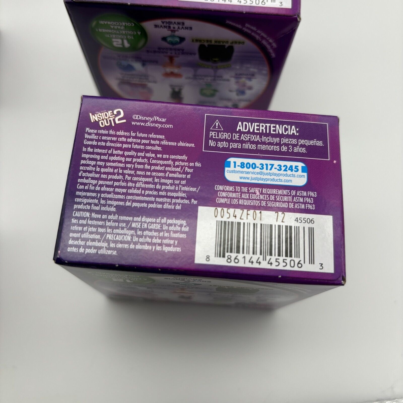 Purple box featuring the Disney Pixar Inside Out 2 Mini Collectible Mystery Figure, with a barcode and warning labels on the back, showcasing various character styles.