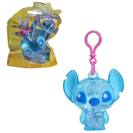 Translucent blue Stitch keyring figure with pink accents and star-shaped eyes, attached to a pink clip, packaged in a colorful yellow and blue bag.