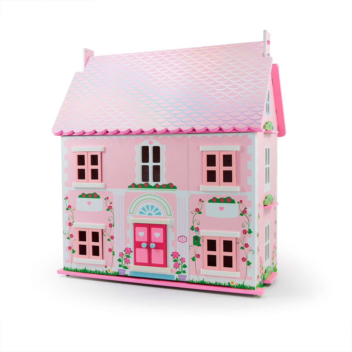 A pink wooden dollhouse with a scalloped roof, heart decorations, flower motifs, and a front door featuring two heart-shaped windows.