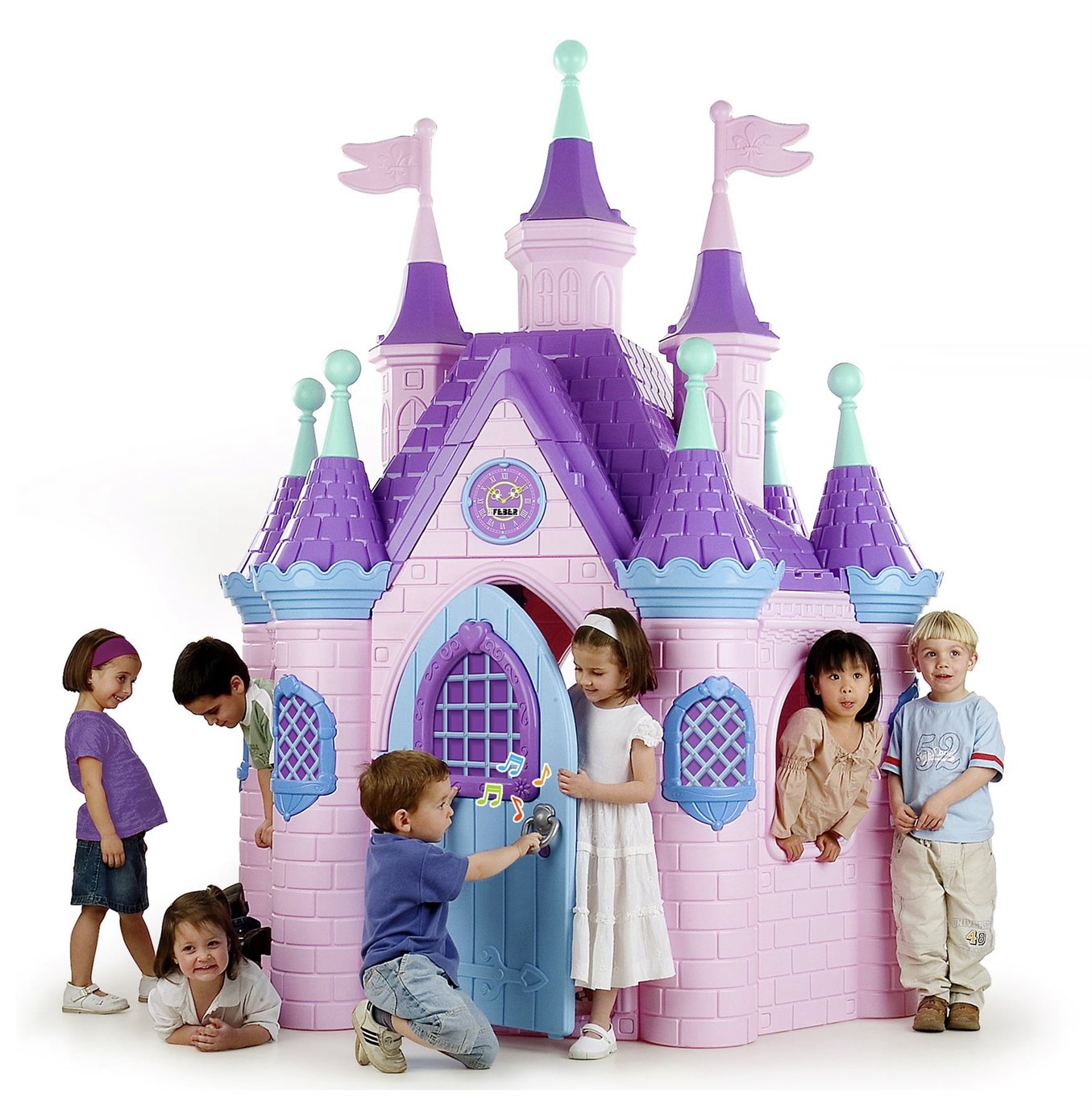Colorful plastic playhouse resembling a castle, featuring purple turrets, a pink facade, and decorative windows, with children playing around it.