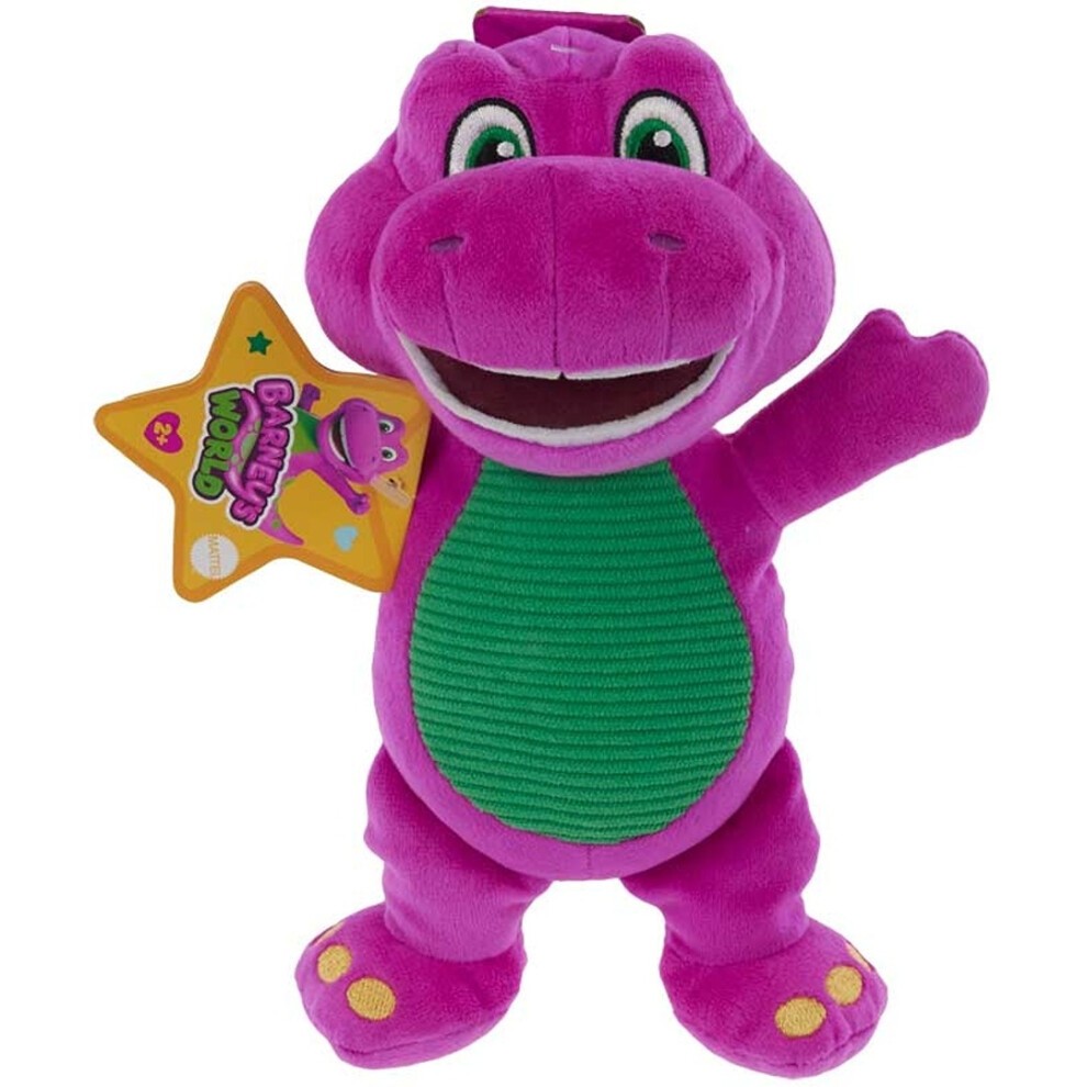 Soft plush dinosaur toy in vibrant purple with a green ribbed belly, smiling face, and yellow feet, featuring a star-shaped tag that reads "Barney's World."