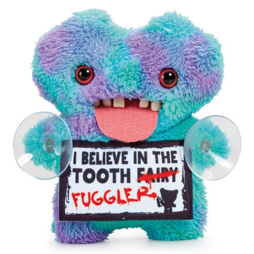 Colorful plush toy with a gap-toothed smile, featuring purple and teal fur, large googly eyes, and two suction cups on its sides, holding a sign that says "I believe in the tooth fairy."