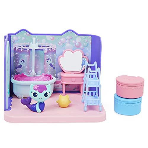 Colorful bathroom playset featuring a pink bathtub, a blue mirror, a purple wall with bubbles, a blue staircase, and a cute teal cat figure with pink accents.