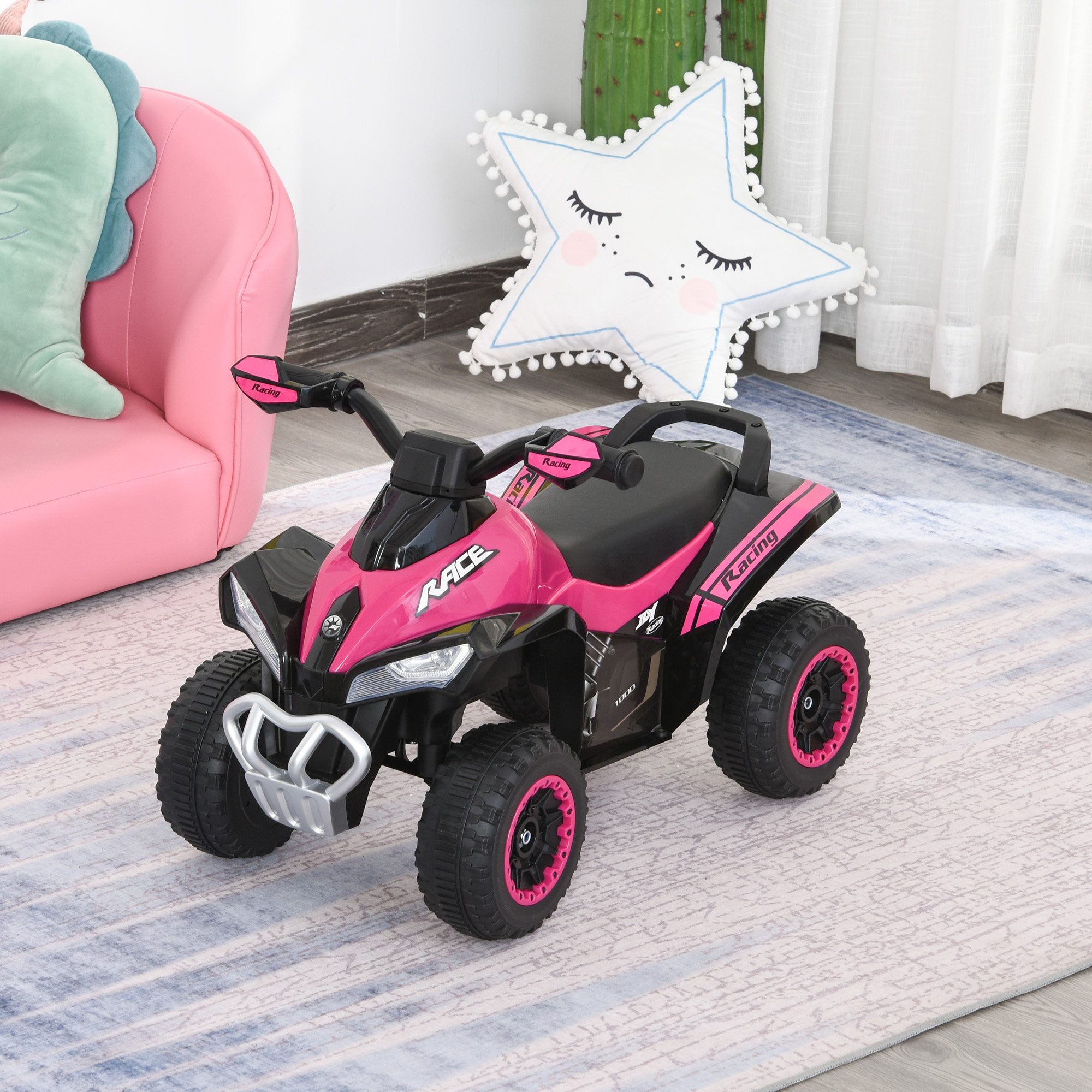 Bright pink and black four-wheeled ride-on toy motorcycle with a foot-to-floor design, featuring large rubber wheels and a sporty front grille, suitable for toddlers aged 18-36 months.
