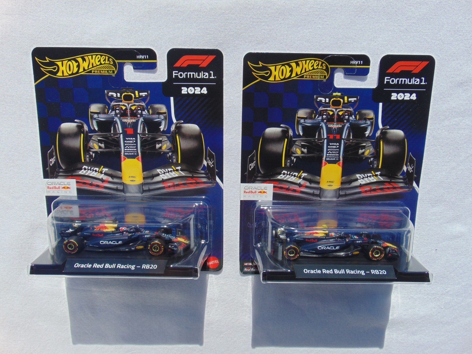Hot Wheels Premium F1 model featuring the BWT Alpine Esteban Ocon #31 car, showcasing a sleek blue and white design with sponsor logos and detailed wheels in a clear display case.