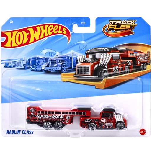 Red and black Hot Wheels Haulin' Class truck with a glossy finish, featuring a large front grille, racing graphics, and a trailer decorated with "VASS OF ROCK" text.