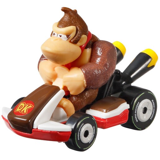 Diecast vehicle featuring Donkey Kong in a brown and red go-kart with yellow exhaust pipes and a "DK" logo on the front, designed for Hot Wheels Mario Kart collection.
