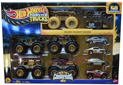 Hot Wheels Monster Trucks Trophy Champions 50th Anniversary multipack featuring 11 vehicles in vibrant colors, including gold wheels, various monster truck designs, and classic cars.