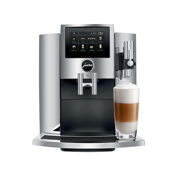 Sleek chrome coffee machine with a digital touchscreen, featuring a milk frother and a glass of layered coffee, designed for brewing various coffee specialties.