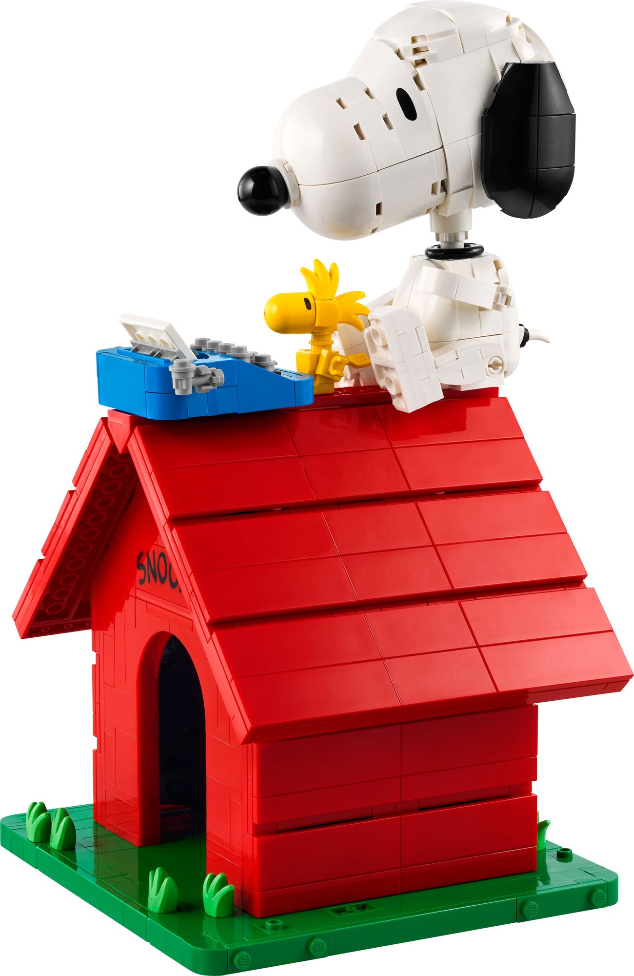 A red LEGO doghouse with a slanted roof, featuring a white Snoopy figure on top and a yellow Woodstock figure beside a blue dog bowl.