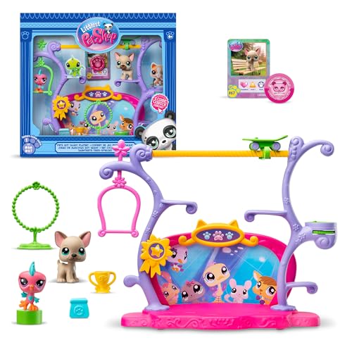 Colorful Littlest Pet Shop Pets Got Talent Playset features a vibrant purple and pink stage, various pet figurines, accessories, and a talent show backdrop.