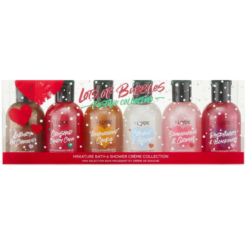 Six 100ml bottles of bath and shower crème in a festive collection, featuring flavors like Luxurious Hot Chocolate and Raspberry & Blackberry, with colorful labels and a clear plastic packaging.